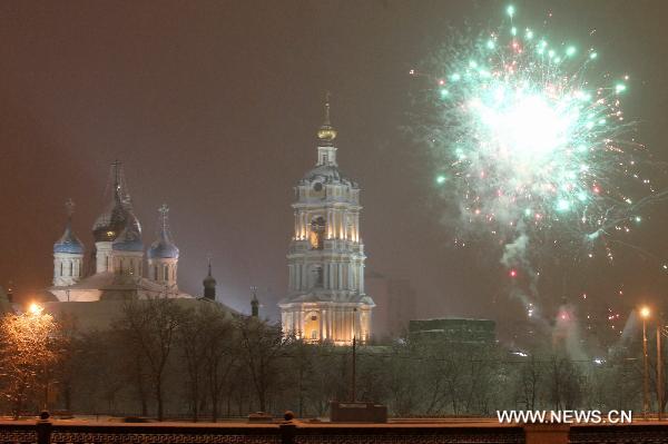 Fireworks explode to celebrate the New Year near a church in Moscow, Russia, Jan. 1, 2011.