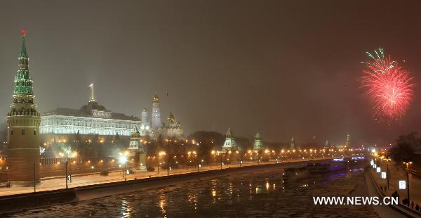 Fireworks explode to celebrate the New Year near the Kremlin palace in Moscow, Russia, Jan. 1, 2011. 