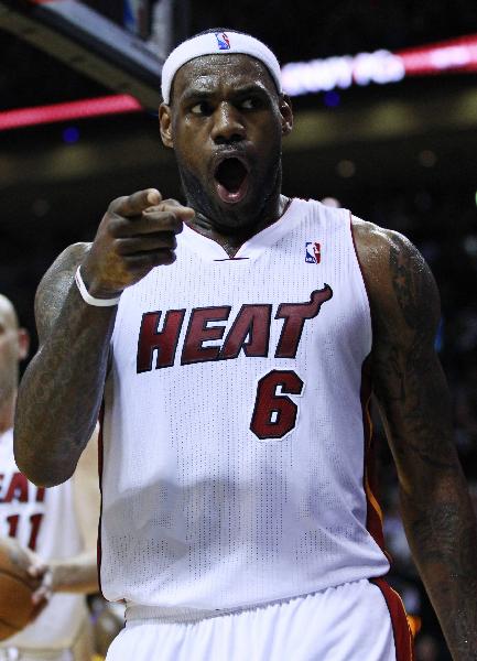 Miami Heat's LeBron James reacts after scoring against the Golden State Warriors during third quarter of NBA basketball action in Miami January 1, 2011. Heat won 114-107. (Xinhua/Reuters Photo)