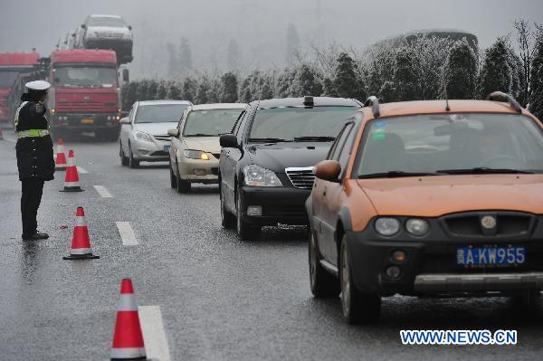 Traffic moves slowly on a highway in Guizhou, southwest China, Jan. 3, 2011. 