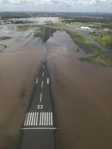Flood water cover much of the runway at the airport in the north Australian city of Rockhampton, about 520km (323 miles) north of Brisbane, Jan 2, 2011. 