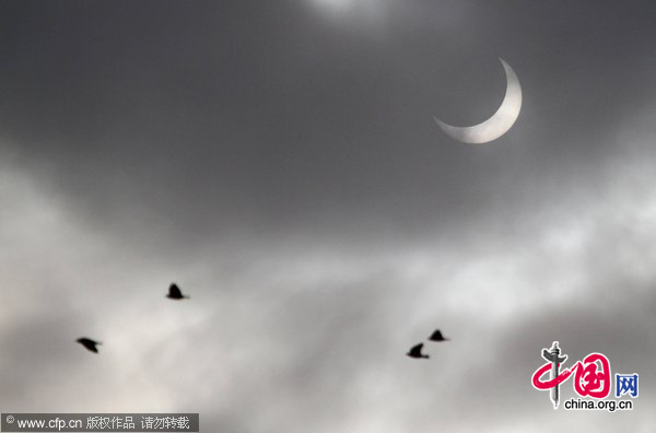 Photo taken on Jan. 4, 2011, shows a partial solar eclipse in Poland. [CFP]