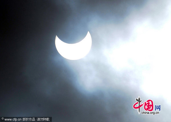 A partial solar eclipse is seen over the Bloomfield Science Museum in Jerusalem, Israel, January 4, 2011. The moon covered 46 percent of the face of the sun and 57 percent of its diameter at it&apos;s fullest moments and lasted three hours. [CFP]