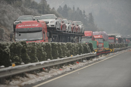 Traffic crawls on the Kunming-Shanghai highway in Hunan Province Tuesday afternoon.