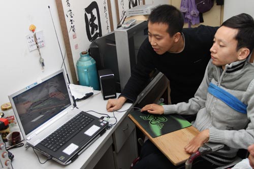 Zhang Yuncheng (right) and his brother Zhang Yuncai update their online shop on Taobao, China's largest online marketplace. The shop sells a range of goods, from clothes to cosmetics.