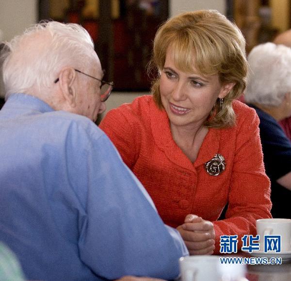 U.S. Representative Gabrielle Giffords (D-AZ), who was shot during an appearance in Tucson, Arizona is seen talking to a voter in an undated handout photo provided by her Congressional office in Washington, January 8, 2011. Giffords was shot in the head while holding a public event in Tucson, Arizona on January 8, 2011.