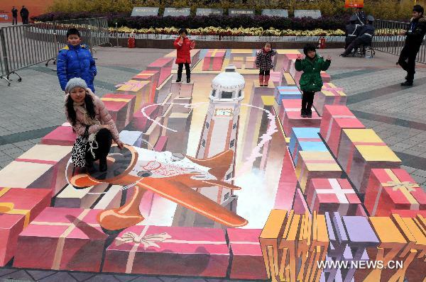 Children stand on a 3D painting on a street in southwest China&apos;s Chongqing Municipality, Jan. 8, 2011. According to the designer, it took 26 days to finish the 3D painting which covers an area of nearly 90 square meters. [Xinhua