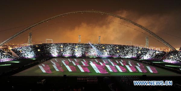 The national flag of Qatar is seen during the opening ceremony of the 2011 Asian Cup football tournament at Khalifa Stadium in Doha, capital of Qatar, Jan. 7, 2011. (Xinhua/Chen Shaojin)