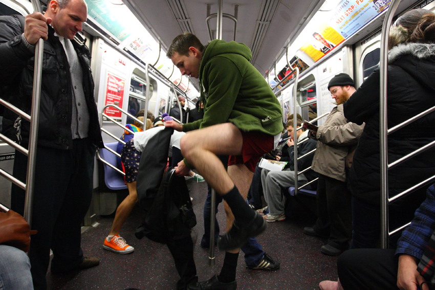 People taking part in the 10th Annual No Pants Subway Ride in New York City January 9, 2011. The New York event, organised by Improv Everywhere, involves participants who strip down to their underwear as they go about their normal routine. [Xinhua]