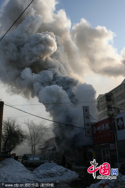 Firefighters work at the explosion site on January 10, 2011 in Changchun, Jilin Province of China. The explosion occurred at 10:00 am at a restaurant, injured 14 customers and the reason is under investigation. [CFP]