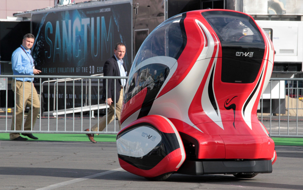 A General Motors Electric Networked Vehicle (EN-V) concept is driven around a course setup outside the Las Vegas Convention Center, in conjunction with the Consumer Electronics Show (CES) in Las Vegas, January 7, 2011. 