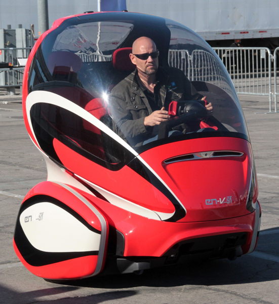 A General Motors Electric Networked Vehicle (EN-V) concept is driven around a course setup outside the Las Vegas Convention Center, in conjunction with the Consumer Electronics Show (CES) in Las Vegas, January 7, 2011.