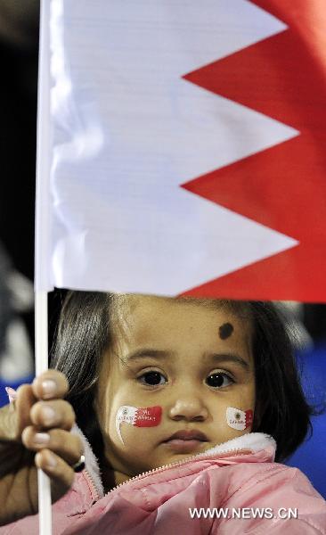 A little girl waits for the 2011 Asian Cup Group C soccer match between South Korea and Bahrain at Al Gharafa stadium in Doha, capital of Qatar, Jan. 10, 2011. South Korea won by 2-1. [Xinhua]