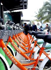 Public bicycles are seen at a rent point in Haikou, capital of south China's Hainan Province, Jan. 11, 2011. The first batch of 60 public bicycles were put into use at four pilot rent points in Haikou on Tuesday, amid a plan of putting 20,000 bicycles at 1,000 rent points around the city in an effort to enhance a low-carbon lifestyle.