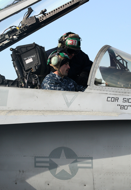 Crew members work on the deck of the U.S. aircraft carrier USS Carl Vinson which is anchored at a South Korean navy port in Busan, South Korea, on Jan. 11, 2011. [Xinhua] 