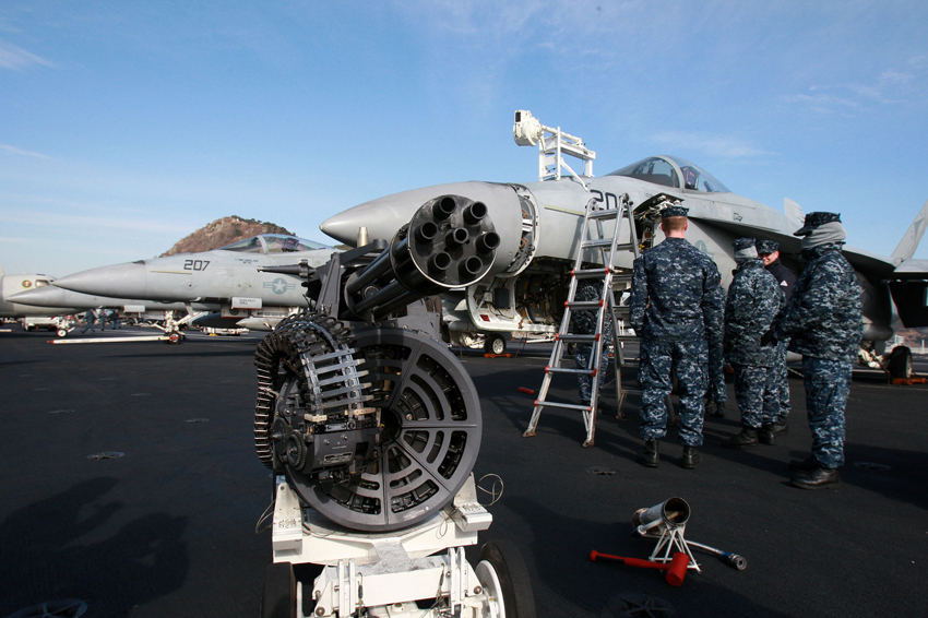 Crew members work on the deck of the U.S. aircraft carrier USS Carl Vinson which is anchored at a South Korean navy port in Busan, South Korea, on Jan. 11, 2011. [Xinhua] 