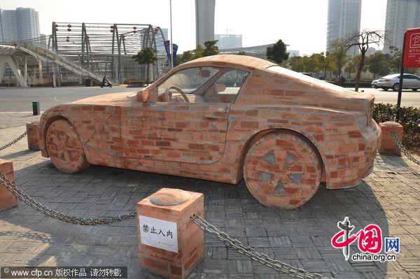 A BMW made of bricks rests by the road in Wuxi, East China&apos;s Jiangsu province, Jan 11, 2010. [CFP]