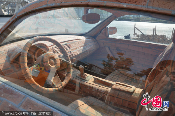 A BMW made of bricks rests by the road in Wuxi, East China&apos;s Jiangsu province, Jan 11, 2010. [CFP]