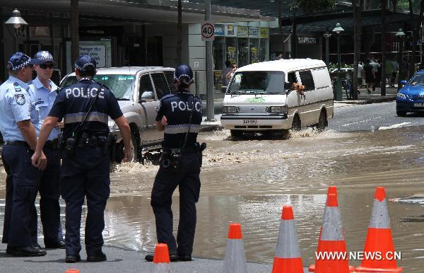 Policemen patrol in flooded streets of Brisbane, Queensland, Australia on Jan. 12, 2011. The threat of further flooding is severe in Australia, where almost 20,000 homes in Brisbane were expected to be swamped in the city. Meanwhile, at least ten people have been killed and 78 are missing after flash floods swept across the state of Queensland. 