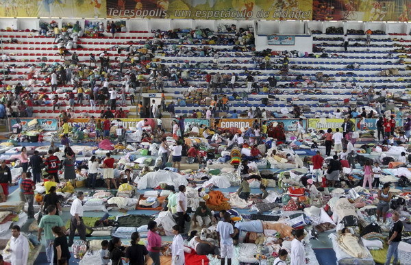 Residents whose homes were destroyed in a landslide rest in a shelter in Teresopolis Jan 13, 2011. [China Daily/Agencies]