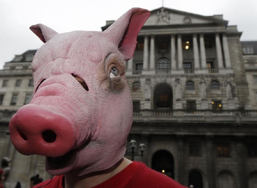 Demonstrators dance during a protest against cuts to arts, public services, health and education outside the Bank of England in London January 14, 2011. [[China Daily/Agemcies]