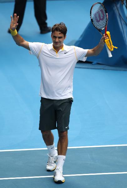 Roger Federer of Switzerland celebrates his victory over Lukas Lacko of Slovakia during their first round men's single match at the Australian Open tennis tournament in Melbourne, Australia, Jan 17, 2011. Federer won 3-0. (Xinhua/Meng Yongmin)