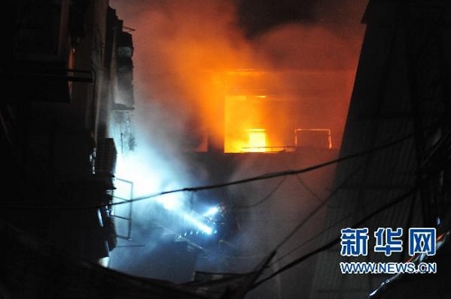 The blaze in a residential area in Wuhan, capital of central China's Hubei Province, Tuesday morning.