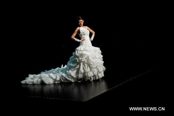 A model presents a creation designed by Italian fashion designer Mossi Giancarlo at Hong Kong Fashion Week for Fall/Winter 2011 in south China's Hong Kong, on Jan. 18, 2011.