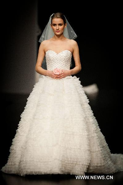 A model presents a creation designed by Italian fashion designer Mossi Giancarlo at Hong Kong Fashion Week for Fall/Winter 2011 in south China's Hong Kong, on Jan. 18, 2011.