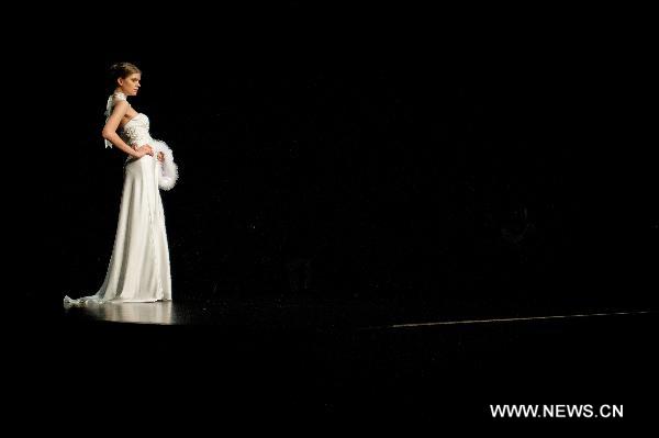 A model presents a creation designed by Italian fashion designer Mossi Giancarlo at Hong Kong Fashion Week for Fall/Winter 2011 in south China's Hong Kong, on Jan. 18, 2011.