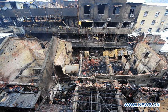 Photo taken on Jan. 18, 2011 shows the site where a fire occurred in a building, which is owned by Hongkang Industry Co. in Qiaokou District, Wuhan City, capital of central China's Hubei Province. [Photo: Xinhua] 