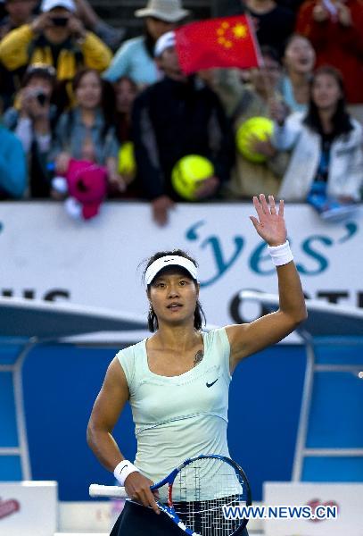 Li Na of China gestures after the second round of women's single match against Evgeniya Rodina of Russia at the Australian Open tennis tournament in Melbourne, Australia, Jan. 19, 2011. Li won 2-0. (Xinhua/Chen Duo) 