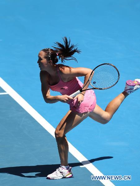 Jelena Jankovic of Serbia serves during the second round match of women's singles against Peng Shuai of China at the Australian Open tennis tournament in Melbourne Jan. 20, 2011. Peng Shuai won 2-0. (Xinhua/Meng Yongmin)