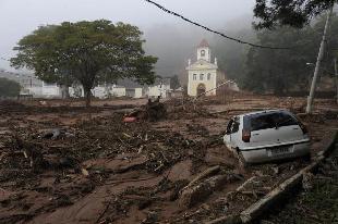 A flood-damaged car is seen trapped in mud in the centre of Nova Friburgo, close to Rio de Janeiro. The World Bank has it will lend Brazil 485 million U.S. dollars for rebuilding and disaster prevention efforts following devastating mudslides that killed more than 700 people. [Xinhua]