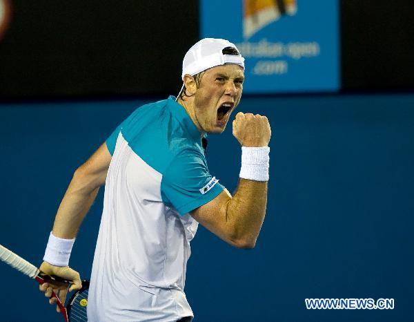 Illya Marchenko of Ukraine celebrates a score during the second round match of men's singles against Andy Murray of Britain at the Australian Open tennis tournament in Melbourne Jan. 20, 2011. Marchenko lost 0-3. (Xinhua/Chen Duo) 