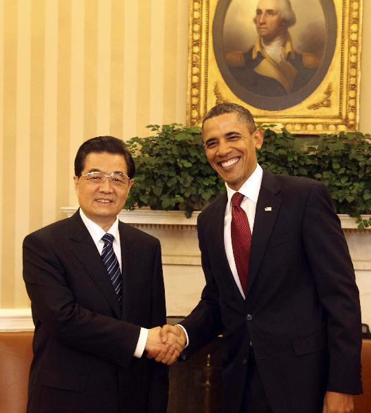 Chinese President Hu Jintao shakes hands with U.S. President Barack Obama during a bilateral meeting at the White House in Washington, the United States, Jan. 19, 2011. [Lan Hongguang/Xinhua]