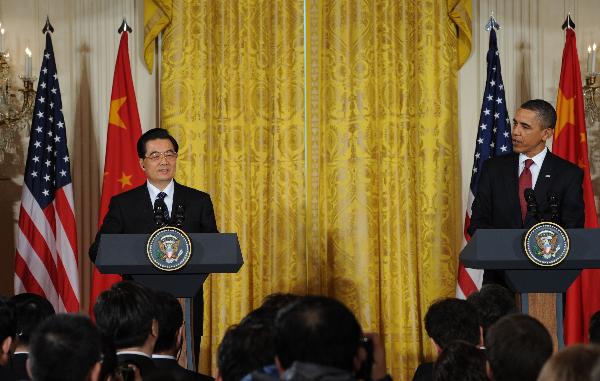 Chinese President Hu Jintao and U.S. President Barack Obama attend a joint press conference at the White House in Washington, the United States, Jan. 19, 2011. [Li Xueren/Xinhua]