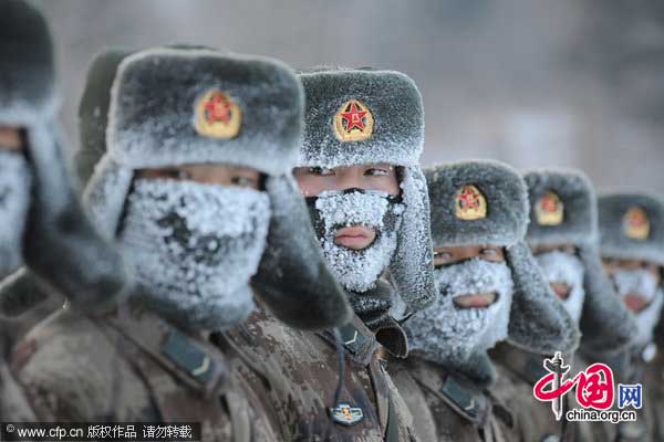New recruit have a drill session in cold outdoor on January 21, 2011 in Yichun, Heilongjiang province of China. 150 new recruit drill at -32℃ outdoor during the drill session. [Photo/CFP]