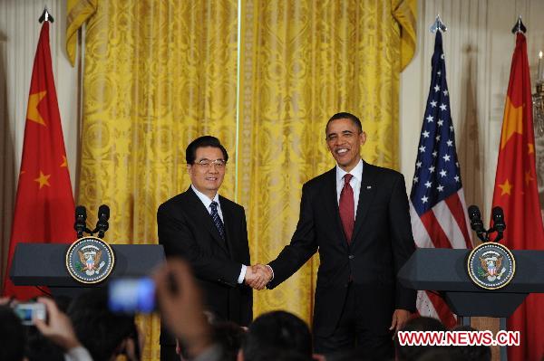 Chinese President Hu Jintao and US President Barack Obama attend a joint press conference at the White House in Washington, the United States, Jan. 19, 2011. [Xinhua]