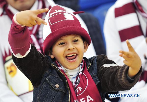 A Qatari boy cheers for the team before the 2011 Asian Cup quarter-final football match between Qatar and Japan in Doha, capital of Qatar, Jan. 21, 2011. (Xinhua/Tao Xiyi) 