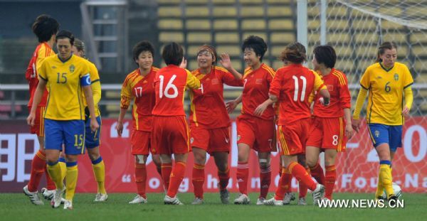 Players of China celebrate a goal during the Four Nation Women's Tournament 2011 match against Sweden in Yongchuan District of southwest China's Chongqing Municipality, Jan. 23, 2011. China won 2-1. (Xinhua/Yang Lei) 