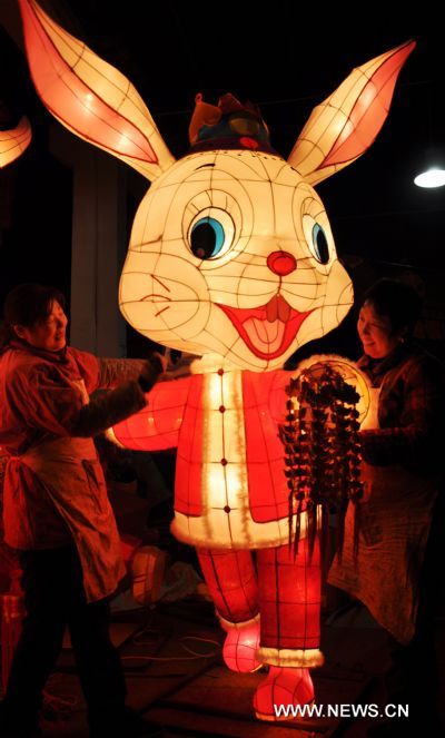 Craftswomen display rabbit-shaped lanterns in a lantern factory in Suzhou, east China's Jiangsu Province, Jan. 23, 2011. The Chinese Lunary New Year began on Feb. 3 this year and it will be the year of the rabbit, one of the twelve Chinese zodiac animals. 