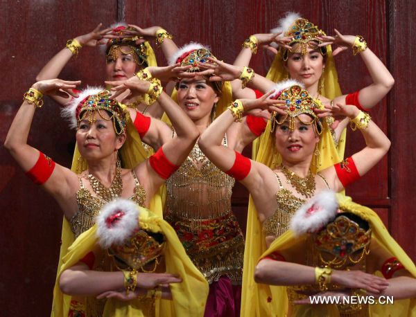 Women dance during a celebration marking the upcoming Chinese Lunar Year of the Rabbit, in Toronto, Canada, Jan. 22, 2011. 