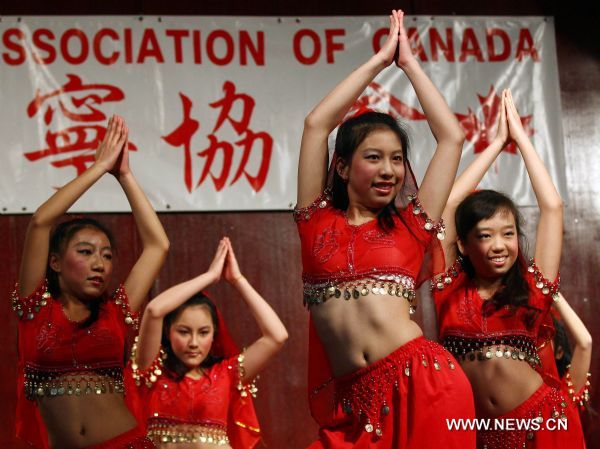 Girls dance during a celebration marking the upcoming Chinese Lunar Year of the Rabbit, in Toronto, Canada, Jan. 22, 2011. 