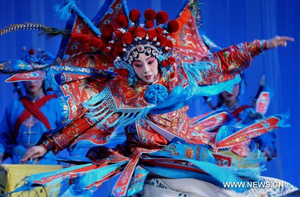 An actress performs Peking Opera in Shenyang, capital of northeast China's Liaoning Province, Jan. 23, 2011. Local Peking Opera troupe performed on Sunday for citizens free of charge, to celebrate the upcoming Chinese Lunar New Year. 