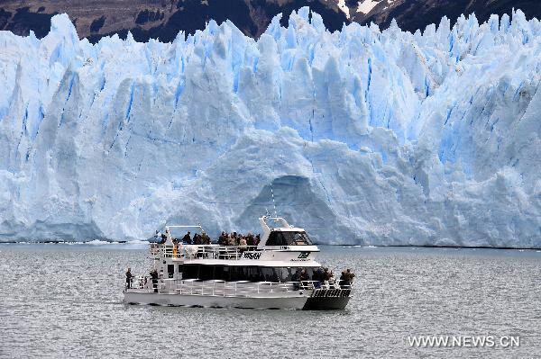 A ship travels in front of the Perito Moreno glacier in Patagonia, Argentina, Jan. 20, 2011. According to a report recently released by the United Nations Environment Program (UNEP), the glaciers in Patagonia melt the fastest in the world.