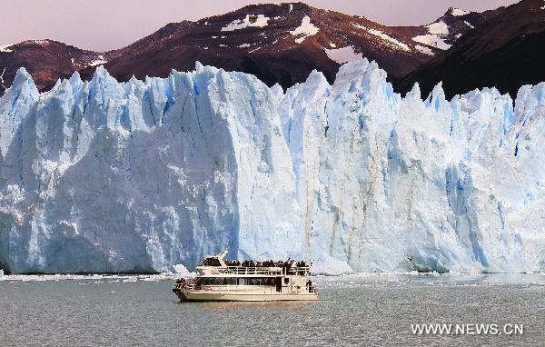 A ship travels in front of the Perito Moreno glacier in Patagonia, Argentina, Jan. 20, 2011. According to a report recently released by the United Nations Environment Program (UNEP), the glaciers in Patagonia melt the fastest in the world.