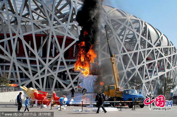 Fire broke out on a sculpture next to the west side of the Beijing National Stadium on Jan 24,2011. The blaze started after a welding accident during the construction of a “Lucky Cloud Rabbit” sculpture. [Photo/CFP]