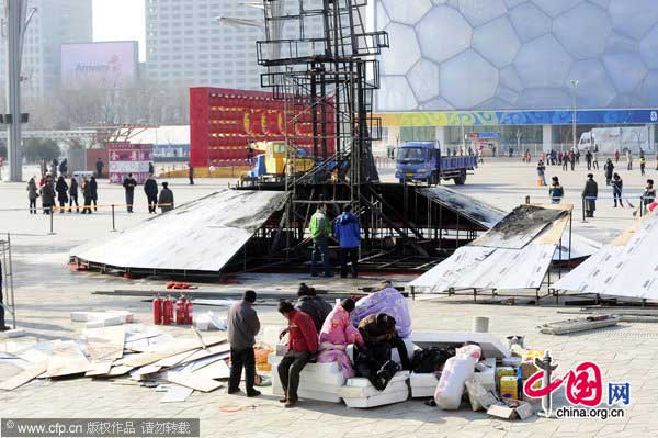 The steel frames of the &apos;Lucky Cloud Rabbit&apos; are damaged after the fire on the west side of the Beijing National Stadium on Jan 24,2011. [Photo/CFP]