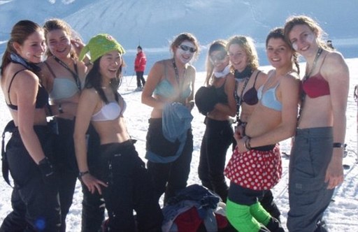 Chilly: Female students pictured on a previous trip stripped to their bras in a French ski resort. This year teams from Oxford and Cambridge universities competed in depraved challenges to win a five-star holiday worth US$3,000